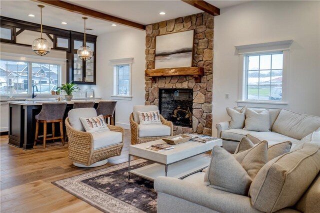 205 Charles Herrmann Way Unit 205, Milo, NY 14527 - living area with beamed ceiling, light wood-type flooring, and a wealth of natural light