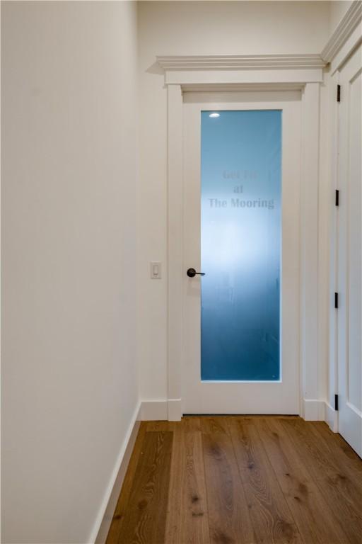 205 Charles Herrmann Way Unit 205, Milo, NY 14527 - hall featuring baseboards and wood finished floors
