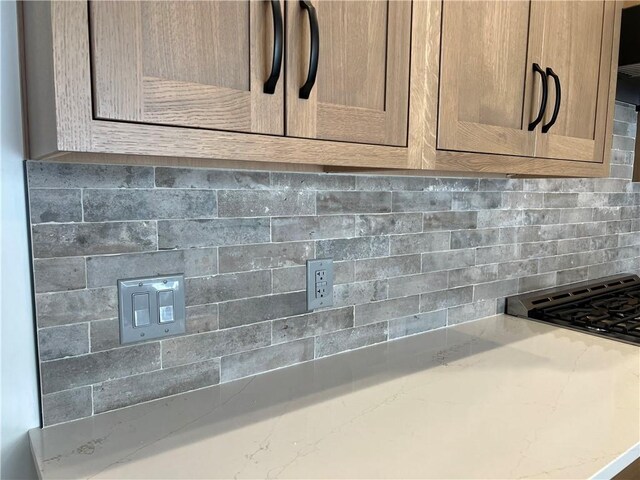 205 Charles Herrmann Way Unit 205, Milo, NY 14527 - room details with tasteful backsplash and light stone countertops
