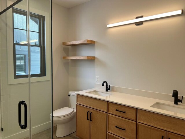 205 Charles Herrmann Way Unit 205, Milo, NY 14527 - bathroom featuring double vanity, a sink, toilet, and a shower stall