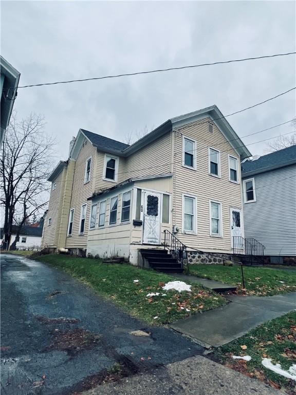 view of property exterior featuring a yard