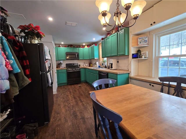 kitchen featuring sink, dark hardwood / wood-style flooring, a chandelier, decorative backsplash, and black appliances