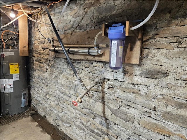 utility room featuring water heater