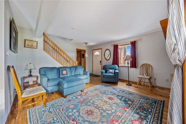 living room with hardwood / wood-style floors and beamed ceiling