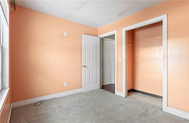 unfurnished bedroom with light carpet