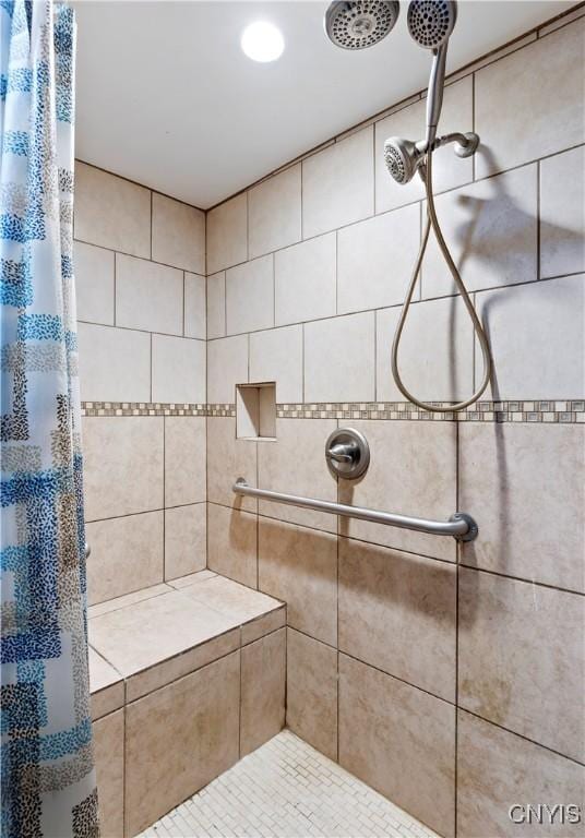 bathroom featuring a shower with curtain