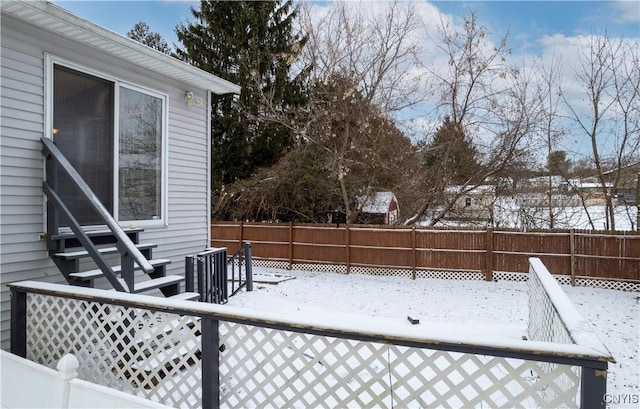 view of yard layered in snow