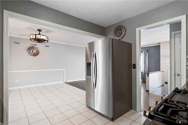 interior space featuring light wood-type flooring and ornamental molding