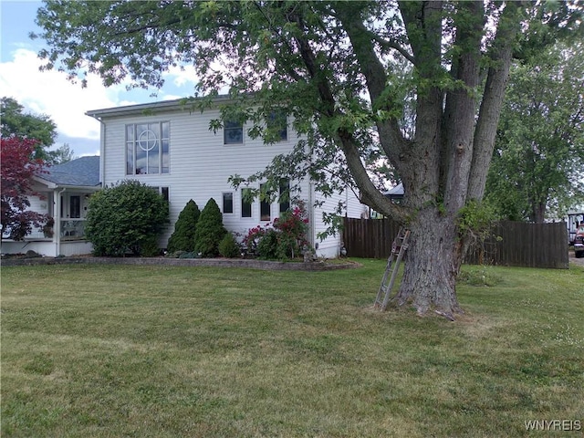 view of home's exterior with a lawn