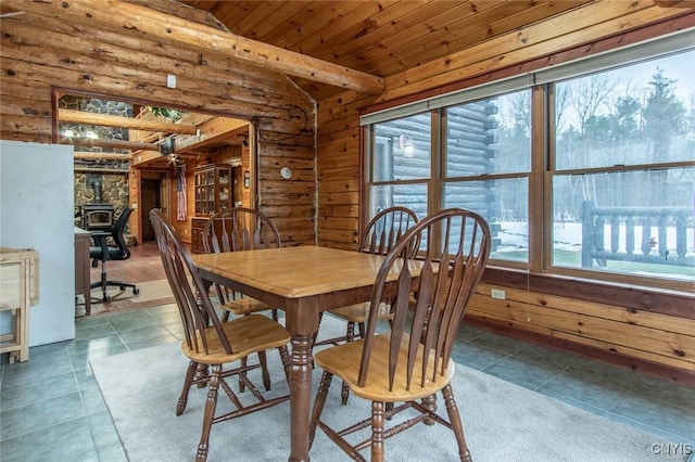 dining area featuring tile patterned flooring, log walls, vaulted ceiling, and wood ceiling