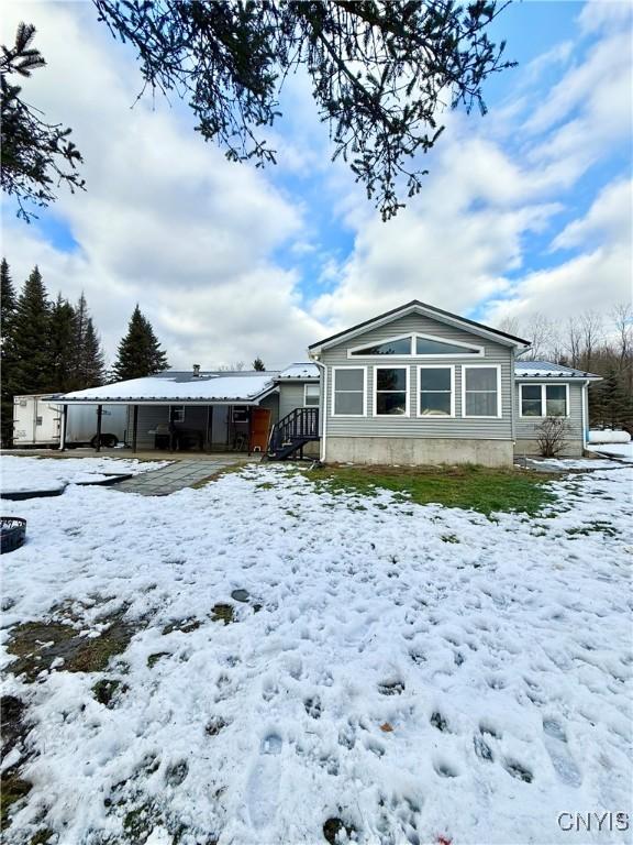 view of snow covered house