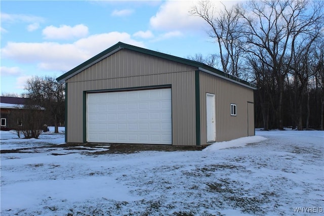 view of snow covered garage