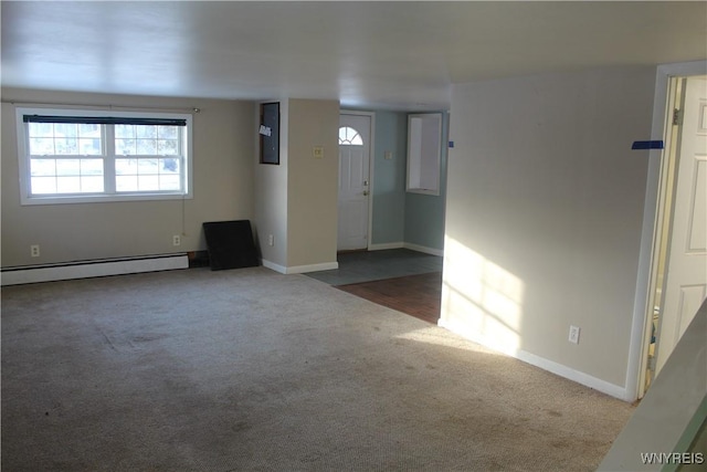 interior space with a baseboard radiator and dark carpet