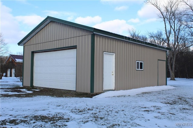 view of snow covered garage