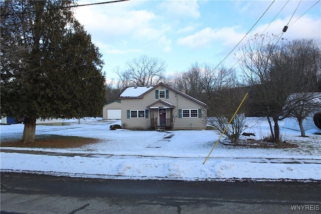 view of front of house with a garage and an outdoor structure