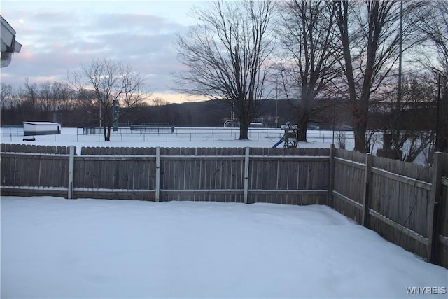 view of yard layered in snow