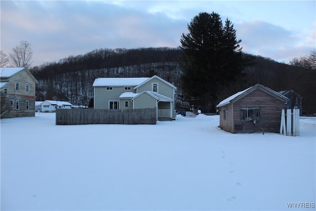 view of yard layered in snow