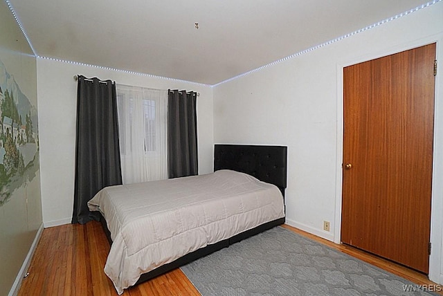 bedroom with hardwood / wood-style flooring