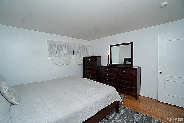 bedroom featuring dark wood-type flooring