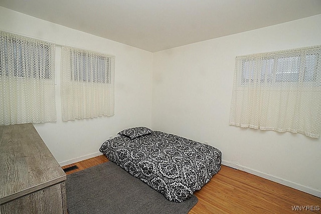 bedroom featuring wood-type flooring