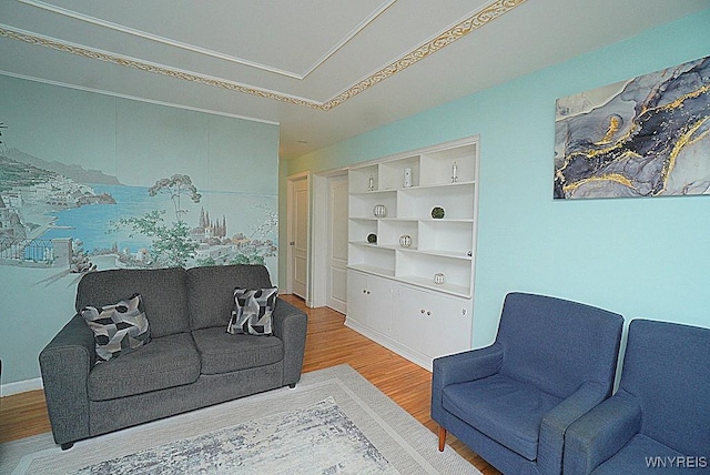 living room with hardwood / wood-style flooring and built in features