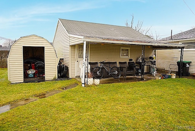 view of outbuilding featuring a yard