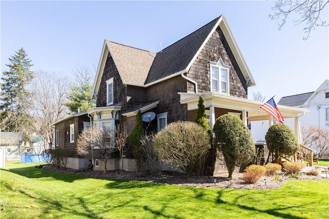 view of property exterior featuring a lawn