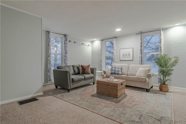 living room featuring light colored carpet and crown molding