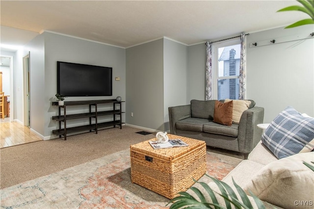 carpeted living room featuring crown molding