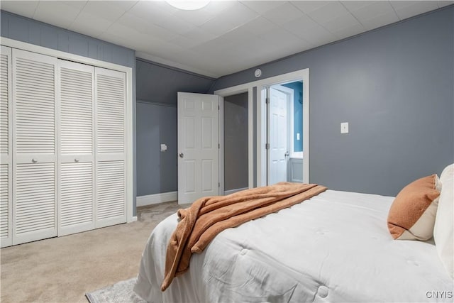 carpeted bedroom with a closet