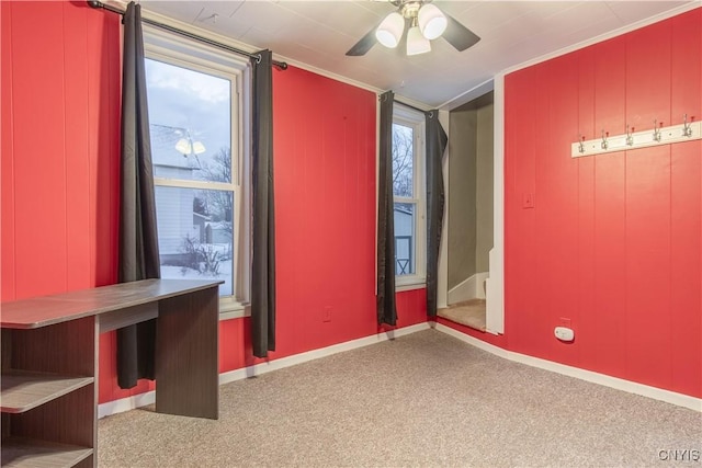 interior space with light colored carpet and ceiling fan