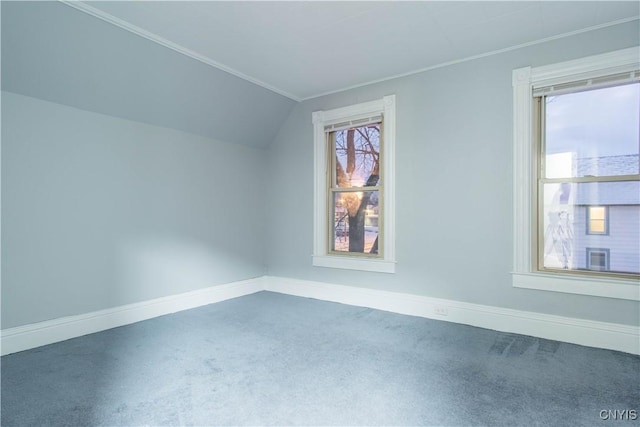 bonus room with dark carpet and lofted ceiling