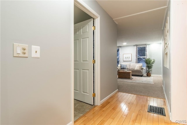 hall with light hardwood / wood-style flooring