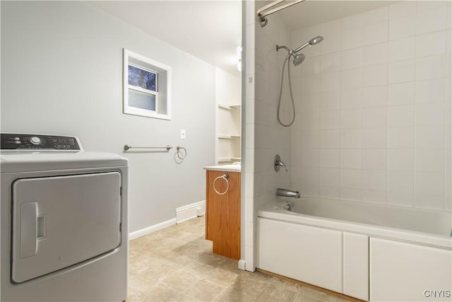 laundry room with washer / clothes dryer and light tile patterned flooring