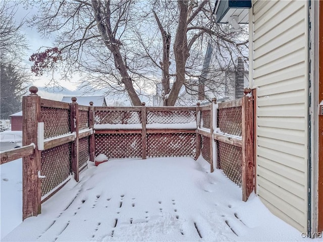 view of yard layered in snow