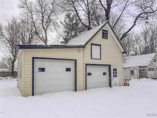 view of snow covered garage