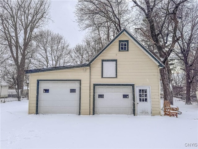 view of snow covered garage