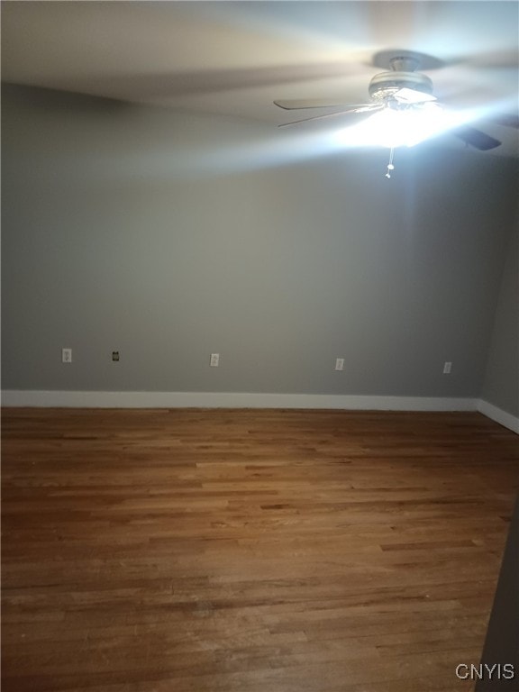 unfurnished room with hardwood / wood-style floors