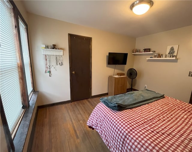 bedroom with wood-type flooring