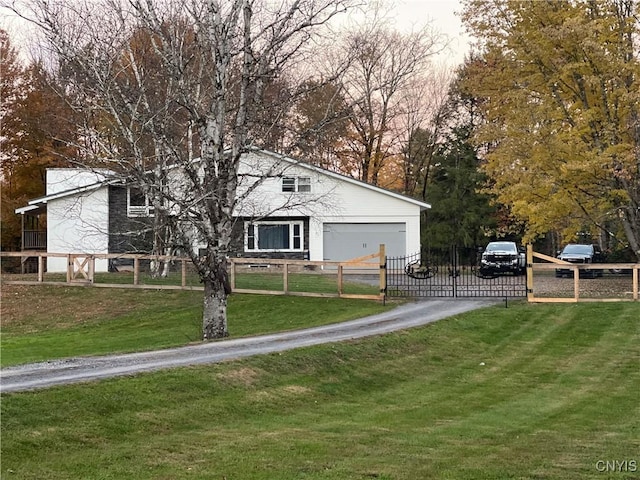 exterior space with a garage and a front lawn