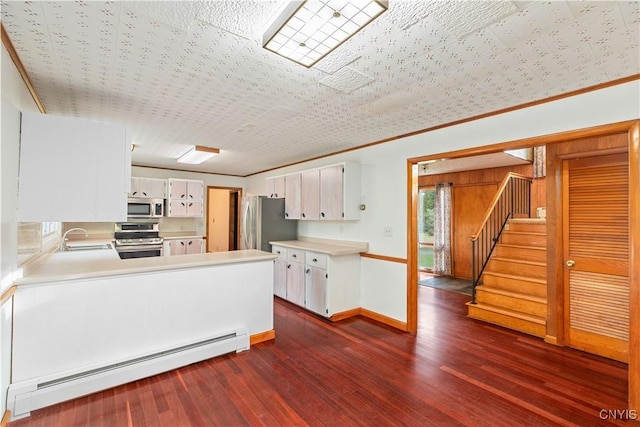 kitchen with a baseboard heating unit, sink, dark hardwood / wood-style floors, white cabinetry, and stainless steel appliances