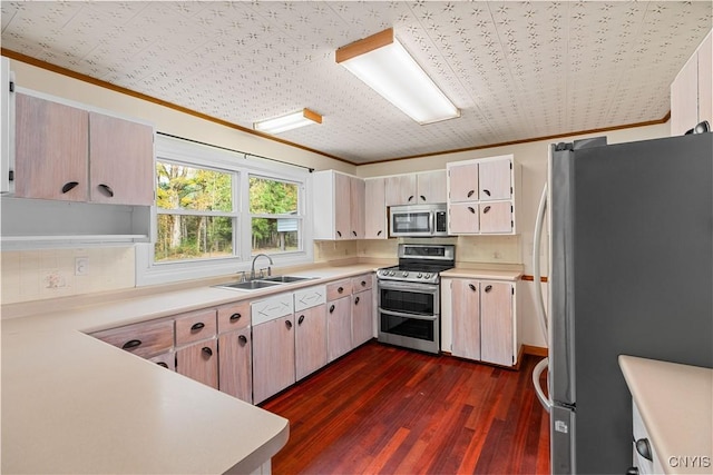 kitchen featuring appliances with stainless steel finishes, dark hardwood / wood-style flooring, tasteful backsplash, crown molding, and sink