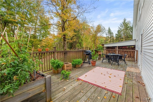 wooden terrace featuring area for grilling