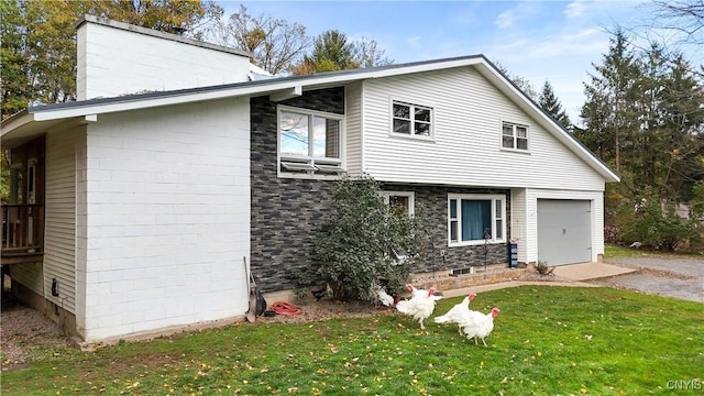 view of front facade with a front lawn and a garage