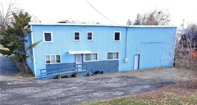 back of property with a wooden deck