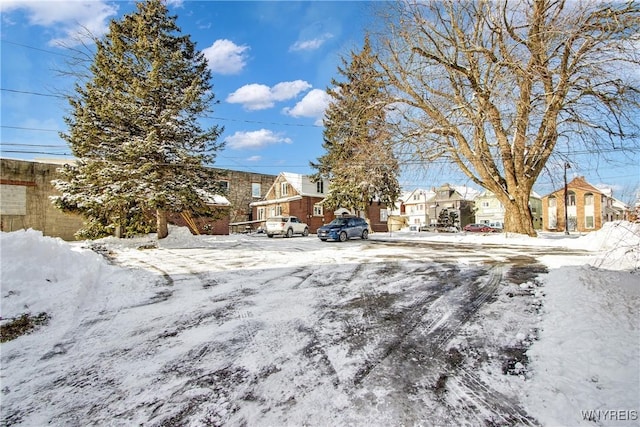 view of yard layered in snow