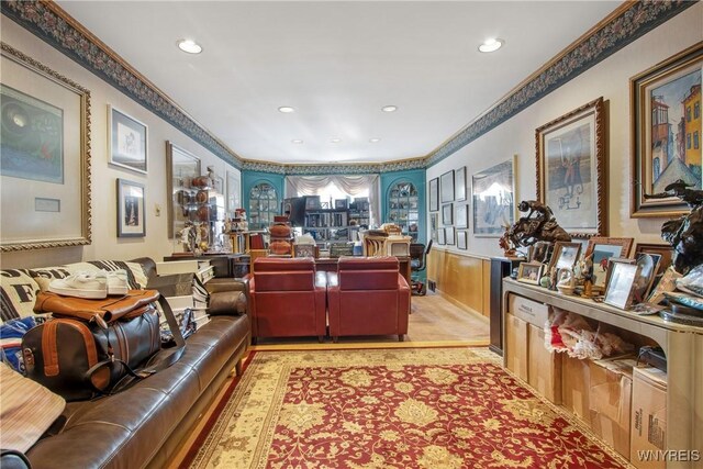 carpeted living room with ornamental molding