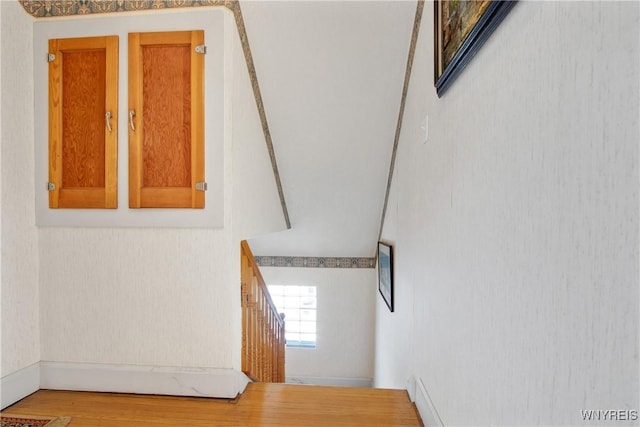 stairway featuring hardwood / wood-style floors