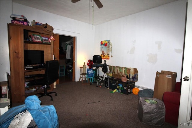 carpeted office space featuring ceiling fan