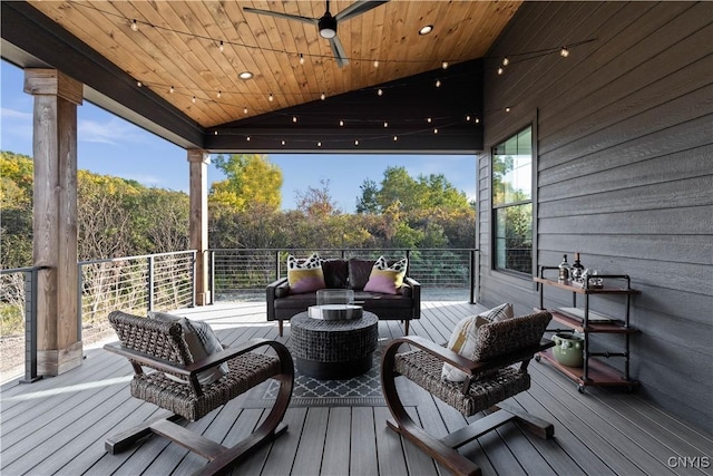 wooden terrace featuring an outdoor hangout area and ceiling fan